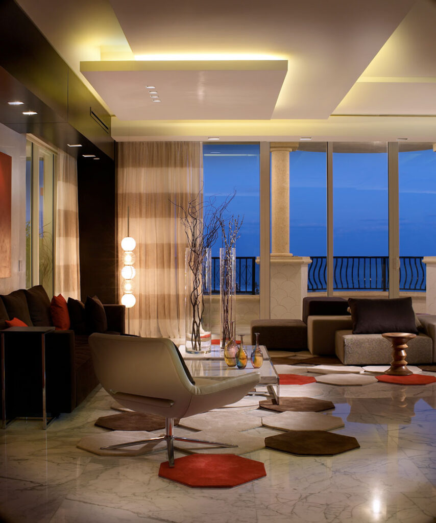 Fisher Island Interior Design a living room with a couch and a table, Fisher Island Interior Design